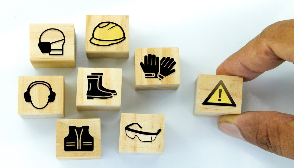 Wooden,Cubes,With,Safety,Icons,Under,Construction.,Safety,First,Construction