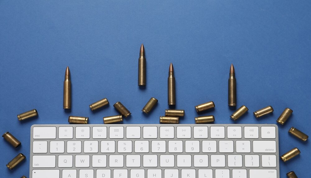 Bullets,And,Computer,Keyboard,On,Blue,Background,,Flat,Lay.,Hybrid